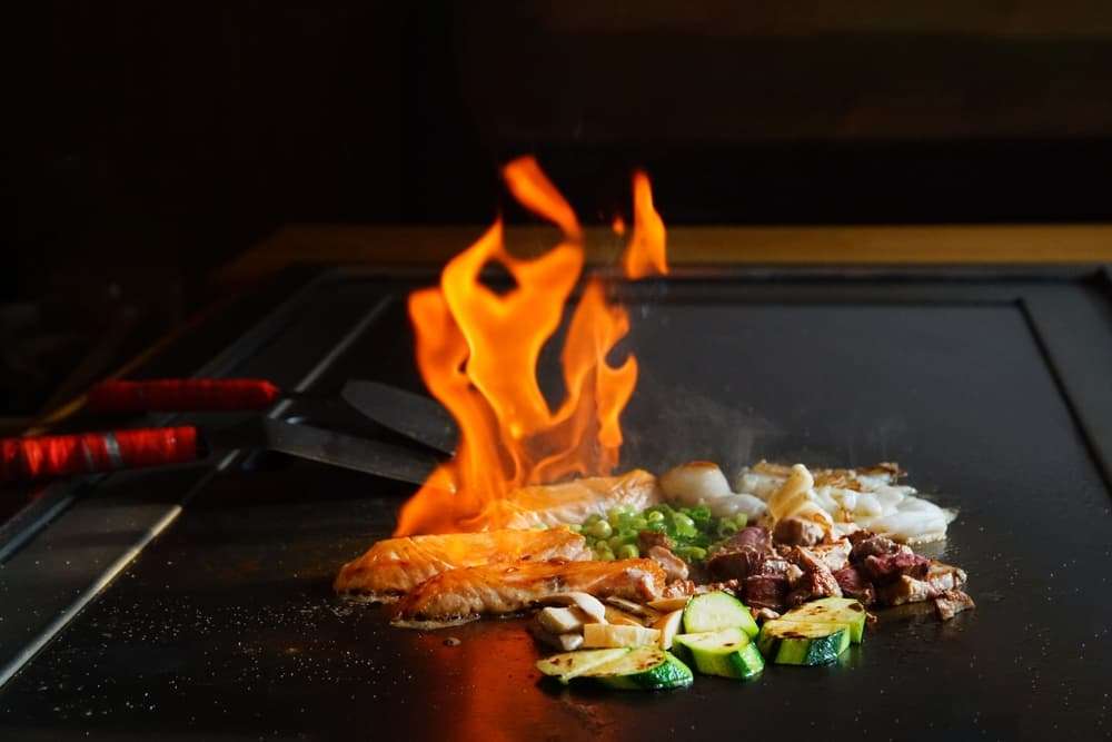 hot-hibachi-grill-with-vegetables-and-meats-cooking hot-hibachi-grill-with-vegetables-and-meats-cooking